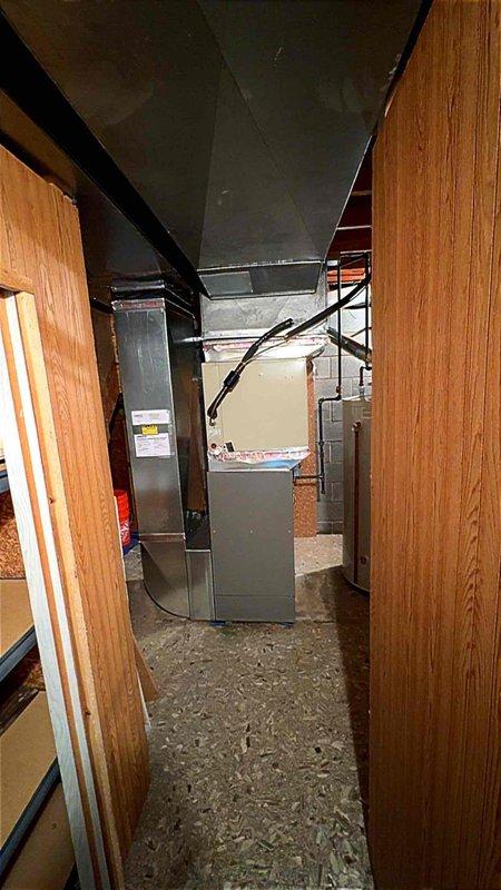 Completed installation of 110K BTU furnace system in rear yard location with mechanical and electrical permits. Raised evaporator coil 4 inches and remeasured outlet transition to ensure proper clearances and airflow. Installed new thermostat, reconnected high velocity package system, and verified static pressure readings using digital manometer to confirm system operates within manufacturer specifications.