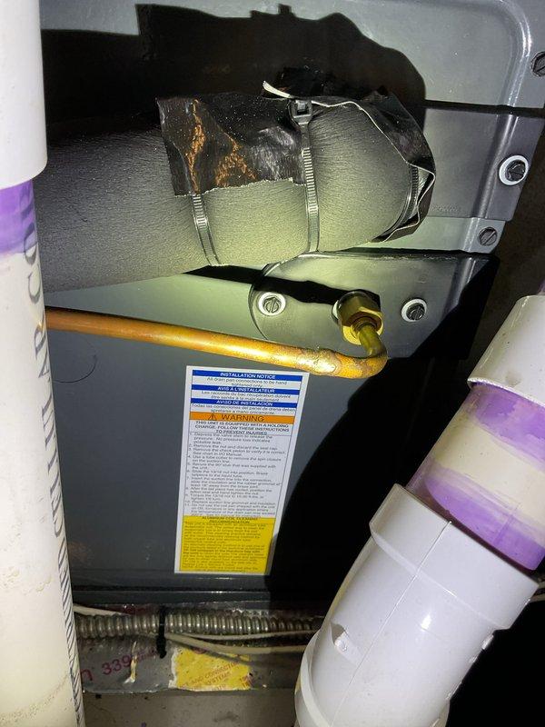Completed annual AC tune-up service on two outdoor condensing units. Performed comprehensive maintenance including coil cleaning, refrigerant charge verification, electrical connection inspection, and operational testing on both systems. During indoor inspection, identified damaged insulation on refrigerant line suction pipe with exposed deteriorated material requiring replacement. Documented Aprilaire humidifier settings and verified proper humidity control configuration for seasonal operation. Both AC units operating within manufacturer specifications upon completion. Recommended scheduling insulation repair to prevent energy loss and potential condensation issues on exposed refrigerant line.