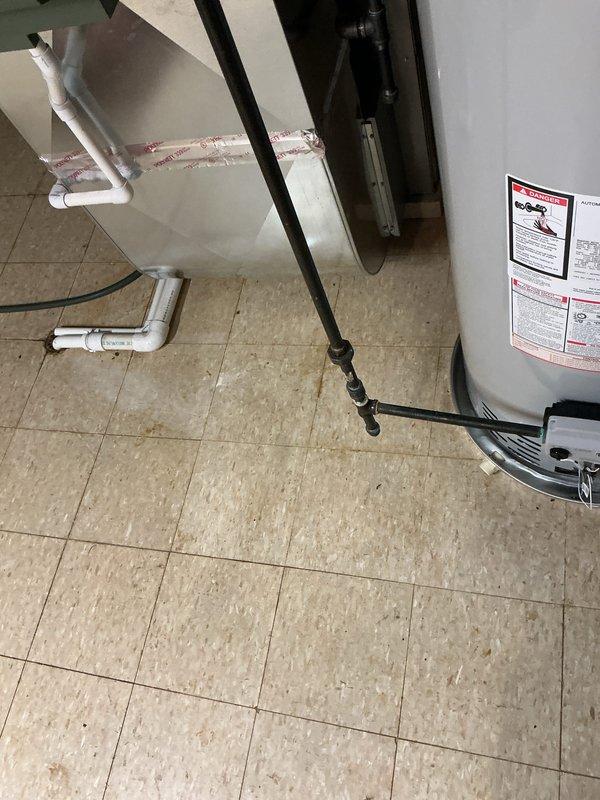 Installed 50-gallon tanked water heater with required drip pan to meet city code compliance. Connected hot and cold water supply lines using copper piping with shutoff valve, established proper plumbing configuration with push-fit connectors and fittings, and completed electrical reconnection to restore full operation of the unit.