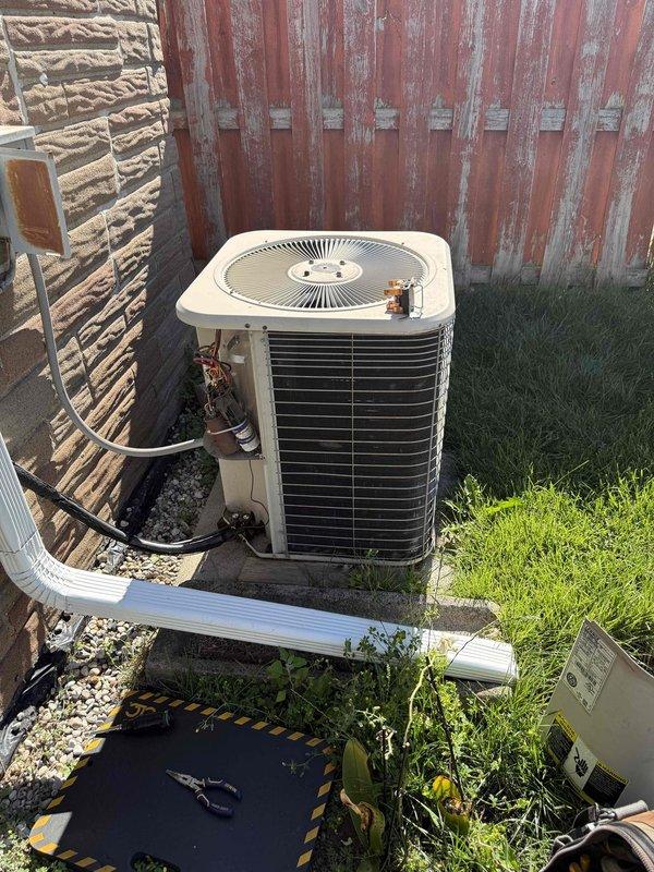Completed comprehensive HVAC tune-up and inspection on residential system with outdoor condensing unit located in basement area. Performed thorough examination of air conditioning condenser including inspection of condenser coils, refrigerant lines, electrical connections, and proper drainage through PVC condensate line. Additionally inspected humidifier, thermostat operation, and hot water tank as requested, ensuring all components functioning within normal parameters and system ready for continued operation.