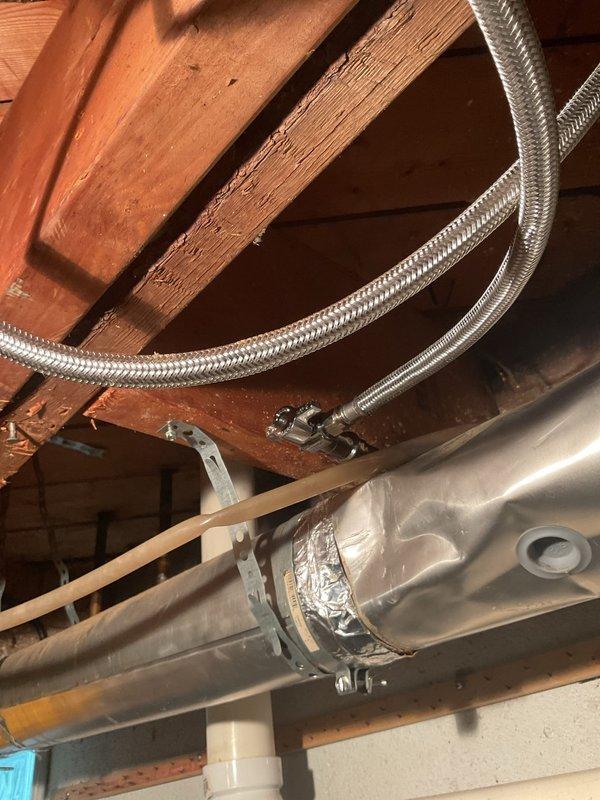 Responded to a water leak originating from a corroded brass valve connection on a supply line in the basement ceiling of a 65-year-old home. Upon inspection, discovered significant mineral deposits and rust deterioration at the valve fitting, which had compromised the seal and caused active water seepage into the affected area below. Shut off the water supply, removed the deteriorated valve assembly, cleaned the threaded connections, and installed a new brass valve with proper thread sealant to restore system integrity. Tested the repair under full pressure to confirm no further leakage and verified proper operation of all connected fixtures.