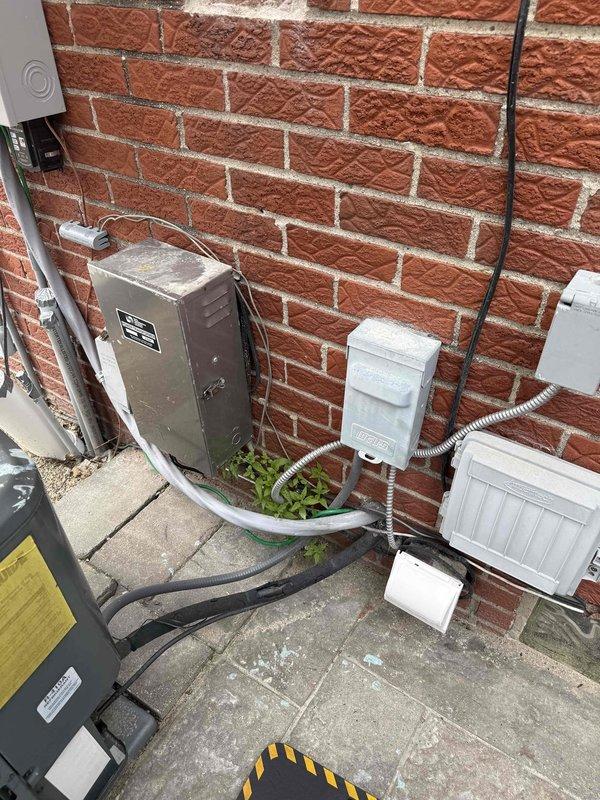 Responded to service call for 13-year-old air conditioning system experiencing short cycling with inadequate cooling. Upon arrival, performed comprehensive diagnostic inspection of outdoor condenser unit located in backyard. Visual examination revealed severely deteriorated electrical connections at the contactor assembly, with extensive corrosion, oxidation, and rust buildup on terminal points. Multiple control wires displayed signs of aging including frayed insulation, discoloration, and compromised connections that could cause intermittent electrical faults leading to short cycling behavior. Documented equipment condition with photographic evidence showing corroded terminals and degraded wiring harnesses. Given the advanced age of the system and extent of electrical deterioration observed, provided assessment of current equipment condition and discussed repair versus replacement options with homeowner to address the short cycling issue and restore proper cooling operation.