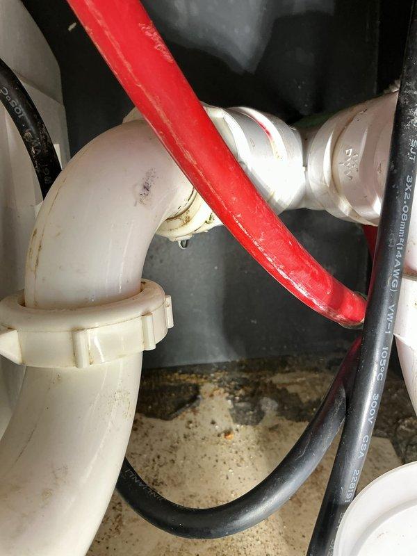 Responded to a sink leak complaint at a commercial medical office. Upon inspection, identified leak originating from deteriorated P-trap connections beneath the sink. Inspected the existing three-stage water filtration system with cylindrical cartridges and verified all filter housings and connections for potential leak sources. Examined PVC drain assembly, P-trap, and associated flexible supply lines. Tightened loose threaded connections on the P-trap assembly and replaced worn compression fittings. Cleaned debris from cabinet base and tested all plumbing connections under pressure to confirm leak resolution. System restored to proper working order with no active leaks detected upon completion.
