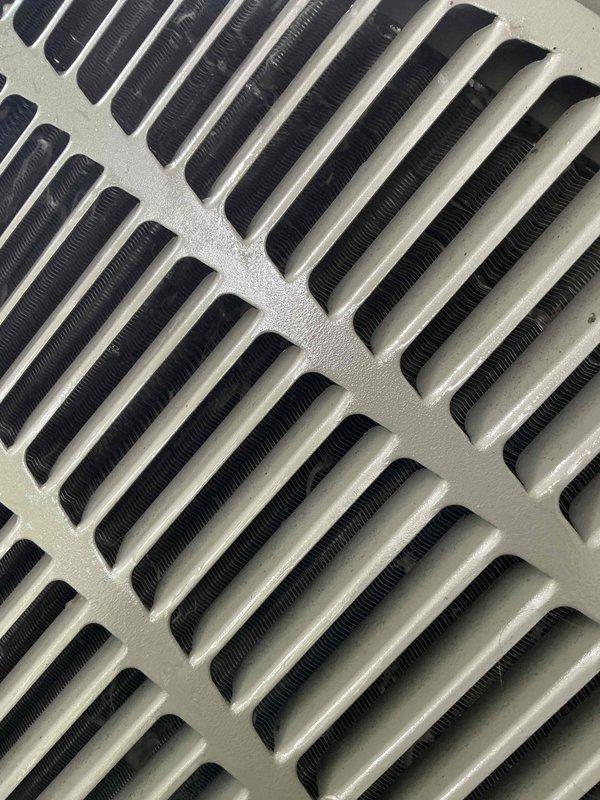 Completed comprehensive Gold AC inspection on 3-year-old residential air conditioning system with outdoor condenser unit and air handler/coil located in small entrance attic. Performed thorough visual examination of condenser unit positioned on rubber pad in backyard, noting unit exterior condition, manufacturer specifications, and refrigerant line connections. Inspected evaporator coil fins for cleanliness and proper airflow, confirming no visible corrosion, damage, or debris accumulation on heat exchanger surfaces. Advised property owner that surrounding condenser area requires clearing of organic debris, leaves, and any animal waste to maintain optimal system performance and prevent airflow restriction.