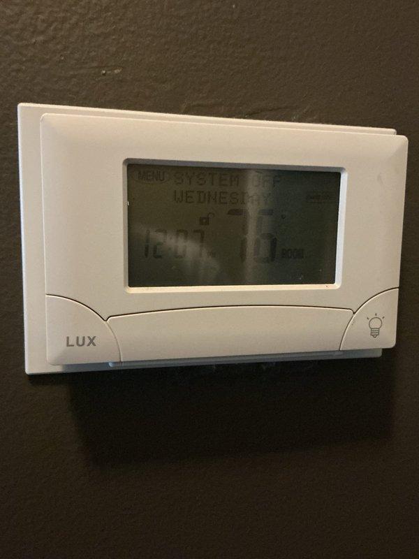 Completed comprehensive inspection and tune-up of 10-year-old boiler system and 2-year-old AO Smith ProLine water heater located in main floor hallway. Verified proper operation of heating unit, inspected all copper piping connections, pressure relief valves, and venting systems for both units. Tested programmable thermostat functionality, confirmed all safety controls operational, and documented equipment condition with no immediate service concerns identified.