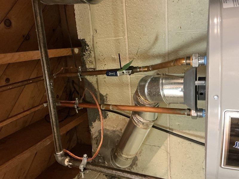 Completed AC inspection and tune-up on 8-year-old cooling system with equipment located in basement. Performed comprehensive system evaluation including indoor air handler components, refrigerant lines, and outdoor condensing unit. System operating within normal parameters; verified proper airflow, checked electrical connections, inspected copper refrigerant lines and condensate drainage, and confirmed outdoor unit fan operation and heat exchanger condition. Customer had replacement filter on hand for installation. All components functioning properly with no issues identified at time of service.
