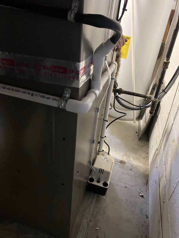 Completed installation of 3-ton air conditioning system with matching evaporator coil in rear configuration. Installed new air handler unit with integrated Space-Gard air filtration system, established proper condensate drainage with pump assembly, and connected all necessary PVC drain lines and refrigerant piping. Secured mechanical, electrical, and air conditioning permits, performed complete system reconnection, tested all components for proper operation, and verified system functionality upon completion.
