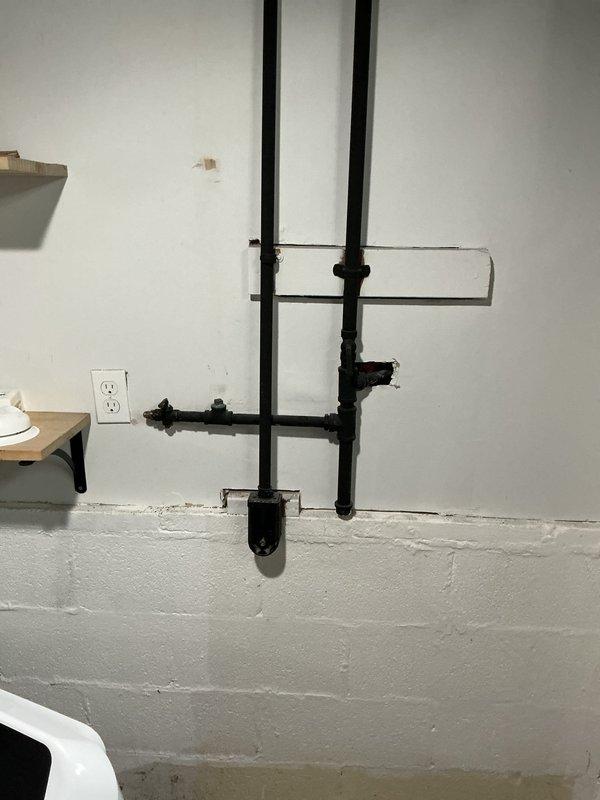 Responded to a gas line issue affecting dryer hookup in basement utility area of 51-year-old home. Assessed existing black iron gas piping configuration and identified problem with gas line routing to dryer location. Adjusted and redirected gas line as needed to properly accommodate dryer connection, ensuring all connections were secure and compliant with safety standards. Performed pressure testing to verify system integrity and checked for leaks at all joints and fittings. All work completed within the four-hour service window, resolving the issue that had been present for four days.