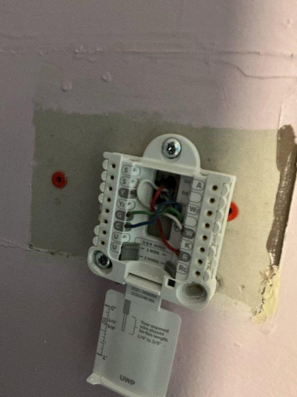 Responded to no-cool call on 6-year-old AC system with unit not powering on. Upon arrival, found thermostat wiring had become loose at terminal connections, preventing proper communication between thermostat and outdoor condensing unit. Inspected all low-voltage wiring at thermostat, identified multiple wires that had backed out of terminals due to improper insertion depth. Removed wires, stripped back oxidized copper ends, and properly reinstalled all conductors to manufacturer specifications ensuring full insertion into terminal blocks. Verified all connections were secure and making proper contact. Restored power to system and confirmed thermostat successfully powered on and communicated with outdoor unit. Cycled system through cooling mode, verified compressor and condenser fan motor engaged properly, and confirmed unit operating normally with no further issues.