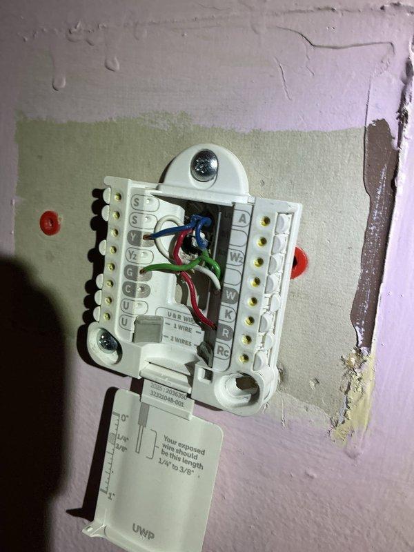 Responded to no-cool call on 6-year-old AC system with unit not powering on. Upon arrival, found thermostat wiring had become loose at terminal connections, preventing proper communication between thermostat and outdoor condensing unit. Inspected all low-voltage wiring at thermostat, identified multiple wires that had backed out of terminals due to improper insertion depth. Removed wires, stripped back oxidized copper ends, and properly reinstalled all conductors to manufacturer specifications ensuring full insertion into terminal blocks. Verified all connections were secure and making proper contact. Restored power to system and confirmed thermostat successfully powered on and communicated with outdoor unit. Cycled system through cooling mode, verified compressor and condenser fan motor engaged properly, and confirmed unit operating normally with no further issues.
