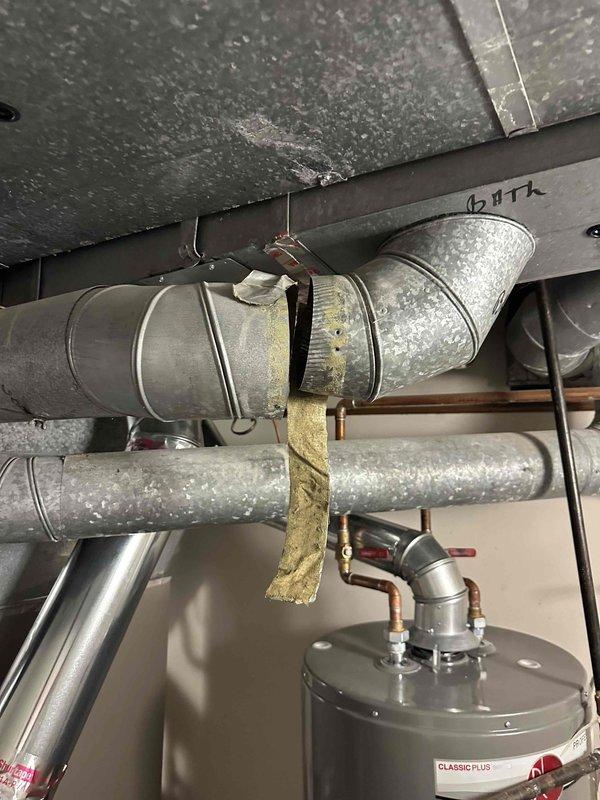 Completed site assessment and documentation for HVAC system quotation. Inspected and photographed existing three-zone forced air system including main air handler unit with Green Zone Z30 control panel serving main floor, second floor, and basement zones. Documented all visible ductwork, copper piping, water heater connections, and mechanical infrastructure to prepare accurate estimate for requested work.