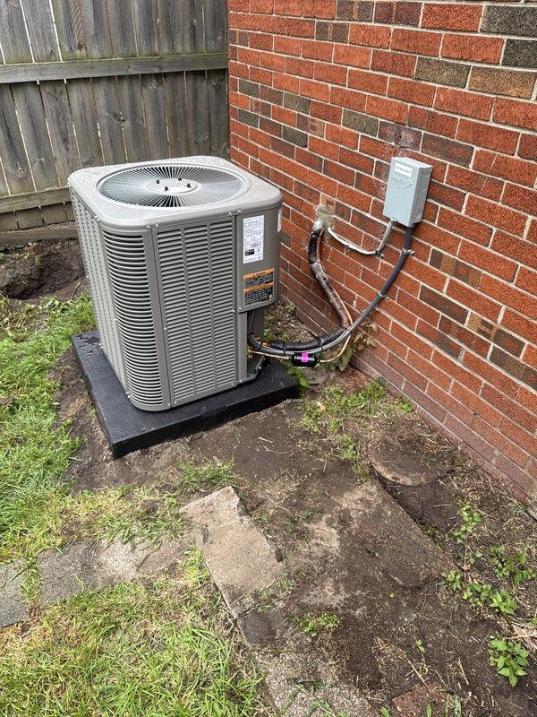 Completed installation of 2-ton air conditioning system with evaporator coil at rear of residence. Installed outdoor condenser unit on rubber pad against brick exterior wall with proper electrical disconnect, refrigerant line set with insulation, and reconnected all components to indoor coil located in basement utility area. Secured all necessary mechanical, electrical, and HVAC permits, installed new thermostat, and verified system operation with proper airflow and refrigerant charge upon startup.