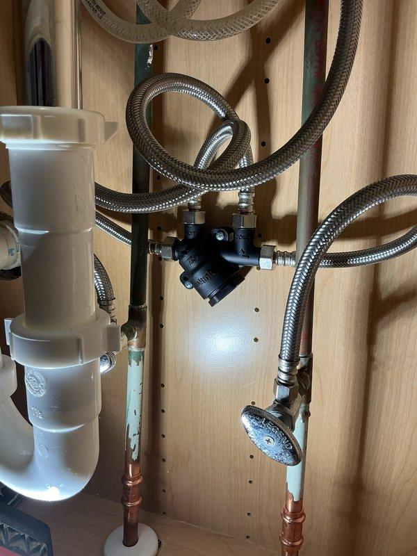 Responded to complaint of whistling noise from pump in master bathroom following recent water heater replacement. Upon inspection, identified recirculation pump generating excessive noise due to air in the system and improper pressure settings. Bled air from hot water lines at manifold connections and adjusted pump speed settings to eliminate cavitation. Verified proper operation of braided stainless steel flex lines, PEX supply connections, and pressure tank assembly. Confirmed all connections at the distribution manifold were secure and leak-free. Tested system operation through multiple cycles to ensure whistling noise was completely eliminated and water flow remained consistent throughout the home.