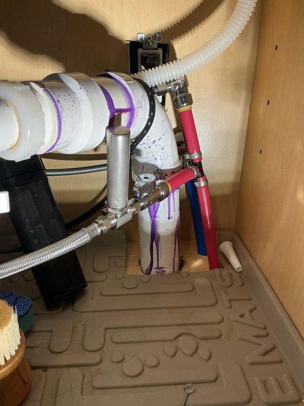 Responded to complaint of whistling noise from pump in master bathroom following recent water heater replacement. Upon inspection, identified recirculation pump generating excessive noise due to air in the system and improper pressure settings. Bled air from hot water lines at manifold connections and adjusted pump speed settings to eliminate cavitation. Verified proper operation of braided stainless steel flex lines, PEX supply connections, and pressure tank assembly. Confirmed all connections at the distribution manifold were secure and leak-free. Tested system operation through multiple cycles to ensure whistling noise was completely eliminated and water flow remained consistent throughout the home.
