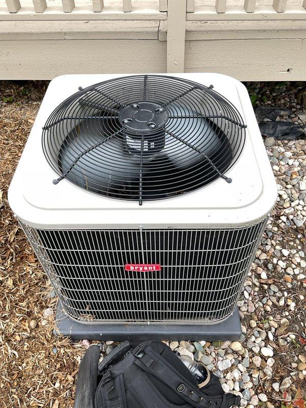 Completed comprehensive gold-level preventive maintenance on a 7-year-old Bryant outdoor condensing unit located at rear of condominium property. Performed full system inspection including electrical connections, refrigerant pressures, condenser coil cleaning, fan motor lubrication, capacitor testing, and thermostat calibration. Verified Aprilaire humidifier control operation and ductwork connections; all components found operating within manufacturer specifications with no deficiencies noted and system returned to optimal performance.