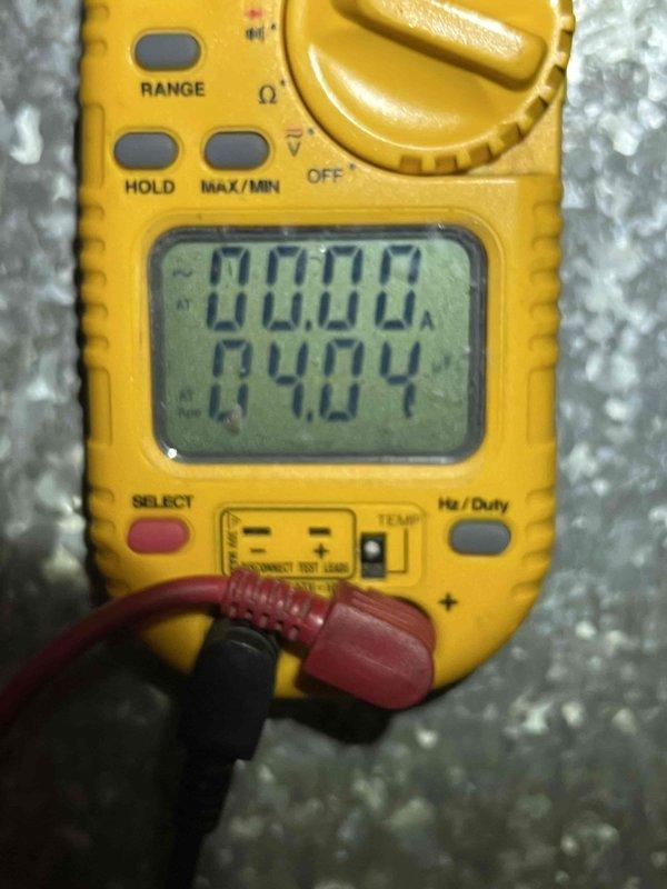 Completed comprehensive AC tune-up on 13-year-old outdoor condensing unit at non-owner occupied property. Performed standard preventive maintenance protocol including electrical testing with multimeter to verify amp draw and system performance, cleaned condenser coils, checked refrigerant levels, inspected all electrical connections, and documented system operation with photos. Unit operating within normal parameters with no issues identified or repairs required at time of service.