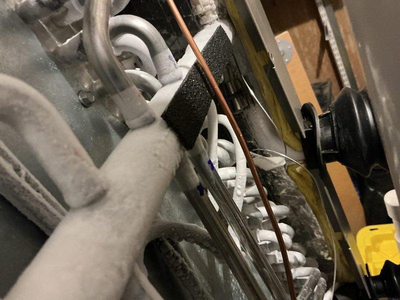 Responded to no-cooling call on residential split system less than one year old. Upon arrival, diagnosed electrical issue preventing compressor operation at outdoor condenser unit. Inspected indoor air handler components in basement and verified proper airflow through evaporator coil and ductwork. Restored power to system, tested all electrical connections at disconnect box, and confirmed unit cycling properly with adequate refrigerant charge and normal operating pressures.
