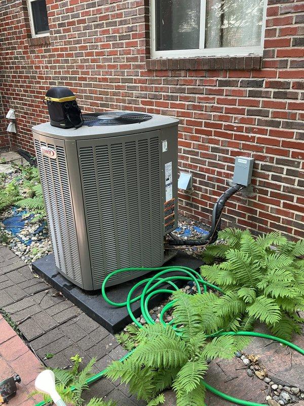 Responded to no-cooling call on residential split system less than one year old. Upon arrival, diagnosed electrical issue preventing compressor operation at outdoor condenser unit. Inspected indoor air handler components in basement and verified proper airflow through evaporator coil and ductwork. Restored power to system, tested all electrical connections at disconnect box, and confirmed unit cycling properly with adequate refrigerant charge and normal operating pressures.