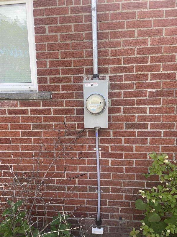 Conducted consultation and provided estimate for air conditioning system replacement. Existing outdoor condensing unit is 18 years old and has reached end of serviceable life. Evaluated electrical service at meter location, assessed thermostat functionality currently set at 73 degrees, documented equipment placement in backyard, and photographed installation site conditions including electrical infrastructure and existing system location to prepare comprehensive replacement proposal.