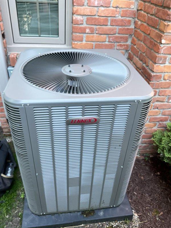 Completed comprehensive Gold AC inspection on 2-year-old Lennox residential air conditioning system. Performed full system evaluation including visual inspection of outdoor condenser unit, verified proper operation of all components, checked refrigerant levels, inspected electrical connections, and assessed overall system performance. Unit operating within normal parameters with no deficiencies noted. Documented equipment condition with photographs for service records.