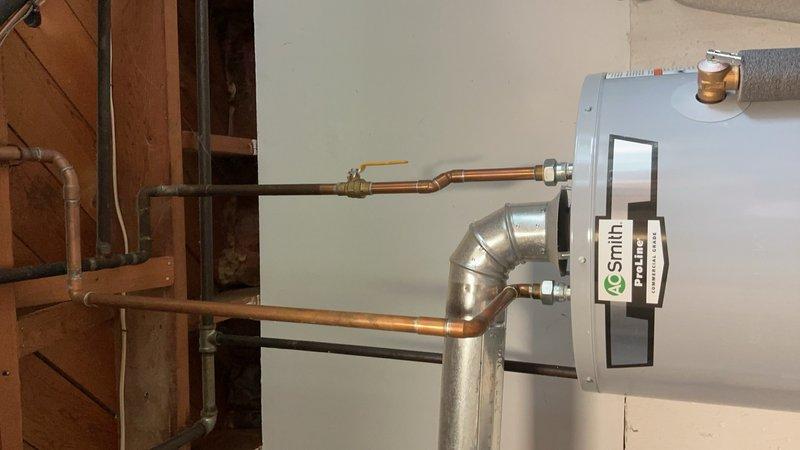 Completed comprehensive Gold AC Inspection on a 16-year-old HVAC system with air handler unit located in basement. Performed standard maintenance protocol including visual inspection of air handler cabinet, condensate pump operation verification, drainage system assessment of PVC piping and connections, and evaluation of overall system components. All equipment found to be operational at time of inspection, with photographic documentation captured for service records.