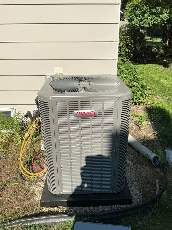 Completed full HVAC system installation including a 90,000 BTU furnace and 3.5-ton Lennox air conditioning unit positioned on the right side of the residence. Obtained mechanical and electrical permits prior to installation, installed outdoor condenser on concrete pad with proper refrigerant line routing and electrical connections, reconnected all system components, and verified proper operation of complete heating and cooling system.