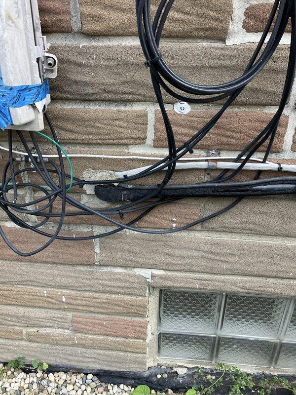 Conducted comprehensive HVAC system evaluation at residential property with basement-located equipment. Performed full system inspection including assessment of existing heating and cooling equipment, humidifier operation, thermostat functionality, and hot water tank condition to provide complete replacement estimate. Documented exterior utility connections and electrical service configurations for new system installation planning.