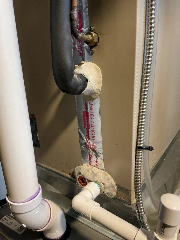 Responded to a recurring water leak at a 1-year-old Lennox furnace located in the basement. Upon inspection, identified condensate drainage issue affecting the evaporator coil assembly and associated copper refrigerant lines. Examined the condensate drain system including PVC drainage piping, trap assembly, and secondary drain connections. Cleared blockage in condensate line, verified proper trap operation, and ensured adequate drainage flow from the evaporator coil pan. Inspected all copper line connections for refrigerant leaks and verified insulation integrity on suction line. Tested system operation through complete heating cycle to confirm condensate removal functioning properly with no active leaks present at time of departure.