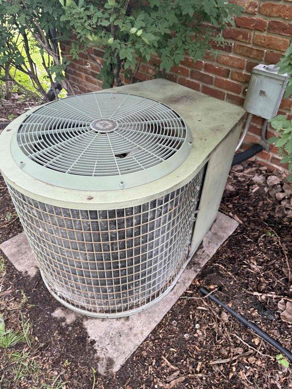 Completed comprehensive tune-up and preventive maintenance on approximately 20-year-old residential air conditioning system with coil-type air handler located in basement. Performed full inspection of outdoor condenser unit, which showed signs of age-related wear and weathering but was operational. Verified proper electrical connections at disconnect box, inspected refrigerant lines, cleaned condenser coils, and assessed overall system performance to ensure efficient cooling operation for the upcoming season.