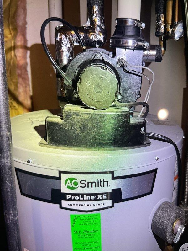 Completed comprehensive Gold AC Inspection on residential HVAC system with equipment less than 10 years old and air handler/coil located in basement. Performed thorough evaluation of all system components, including inspection of Honeywell humidistat control mounted on equipment panel, verified proper dial settings and operational status. Documented AO Smith ProLine XE commercial grade water heater with top-mounted circulator pump assembly, inspected associated piping connections and verified system integration. Advised customer that condenser area must be maintained clear of debris and animal waste for optimal performance and system longevity.