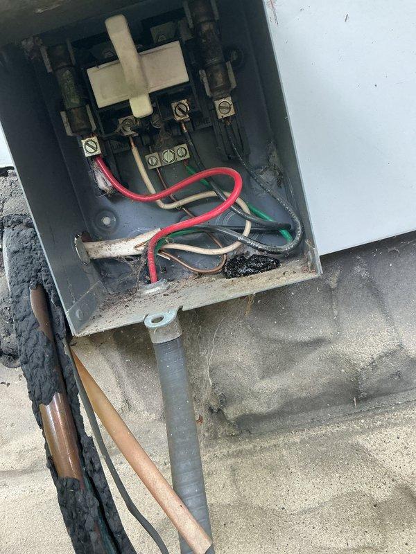 Responded to service call for air conditioning unit that would not shut off and required manual shutdown at furnace switch. Upon inspection of the outdoor condensing unit and electrical disconnect, found aged equipment with corroded wiring connections and deteriorated components. Diagnosed faulty contactor causing unit to run continuously without responding to thermostat signals. Replaced defective contactor, cleaned electrical connections, and verified proper system operation with normal on/off cycling restored.