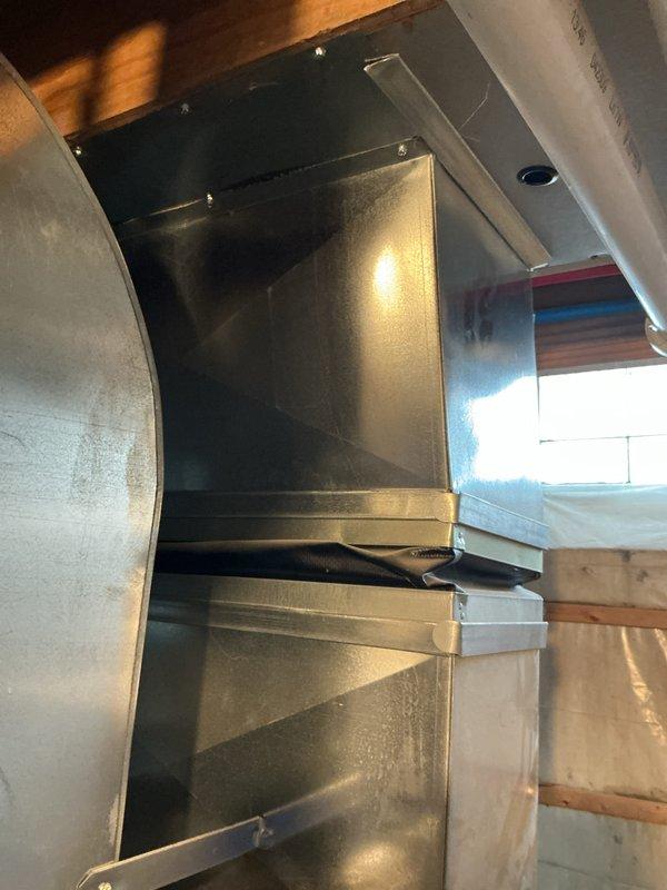 Performed annual AC tune-up and cooling maintenance on 16-year-old Bryant system. During inspection, discovered failed secondary heat exchanger in furnace unit, resulting in system shutdown for safety. Documented existing HVAC equipment configuration including furnace, ductwork, and associated mechanical components in basement utility area.