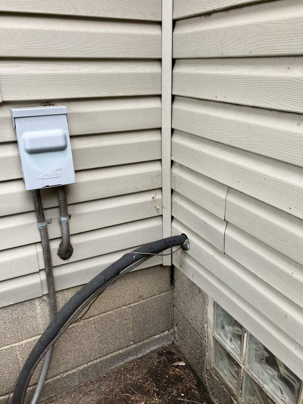 Responded to service call for recurring furnace leak in basement and R-22 air conditioning system freezing over. Conducted comprehensive assessment of one-year-old furnace installation and evaluated existing air conditioning unit performance. Identified issues with condensate drainage system contributing to furnace leak and diagnosed refrigerant system concerns causing evaporator coil freeze-up on aging R-22 equipment. Documented current thermostat operation showing 74-degree setpoint and inspected exterior HVAC components including refrigerant line sets, electrical disconnect, and condensate drainage routing along foundation. Provided complete system replacement estimate addressing both furnace reliability concerns and obsolete R-22 air conditioning equipment requiring upgrade to modern, efficient HVAC system.