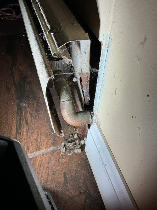 Conducted on-site assessment to provide estimate for removal and reinstallation of boiler baseboard heating units to accommodate upcoming renovation work. Inspected existing baseboard heating system in basement utility area, evaluated mounting hardware and connection points, and documented current conditions including deteriorated door hardware and foundation settling evidenced by concrete floor cracking. Generated comprehensive quote for temporary removal of baseboard units, protection during construction phase, and professional reinstallation upon completion of homeowner's renovation project.