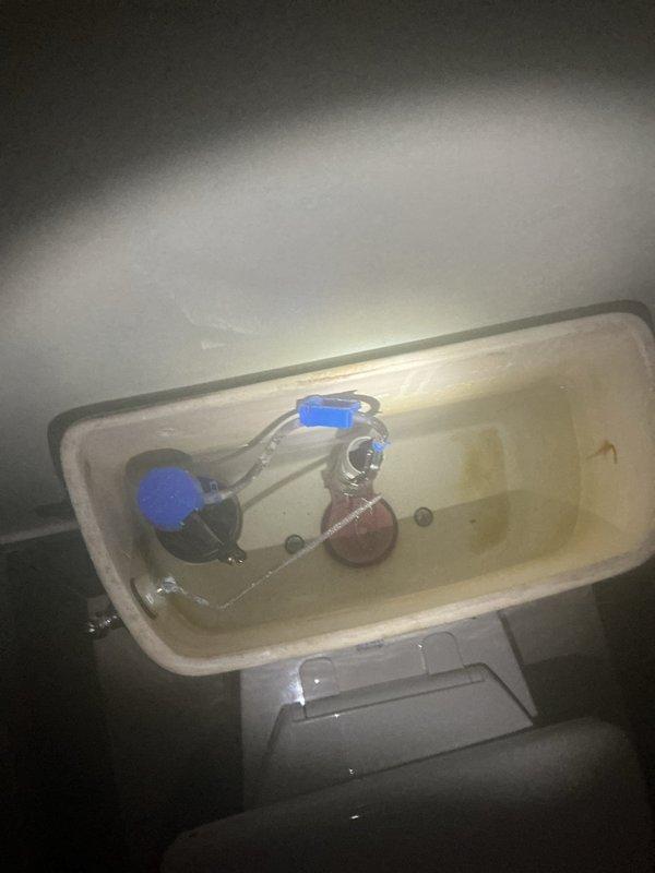Responded to service call requiring camera inspection and heavy-duty drain clearing equipment. Deployed large capacity snake machine to address main line stoppage. Documented existing plumbing fixtures including toilet tank components and bathroom installation conditions through photographic evidence for service records.