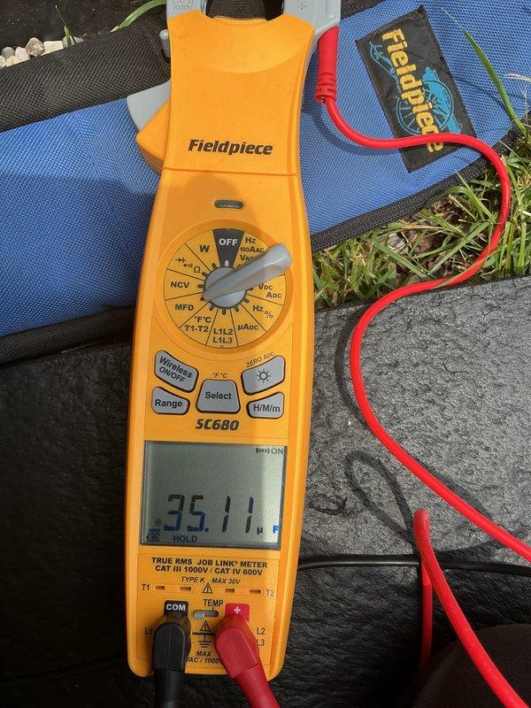 Responded to service call for 2-month-old AC system producing loud clanking noise during startup and shutdown cycles. Performed diagnostic testing on both indoor and outdoor units using clamp meter and multimeter to measure electrical parameters including amperage, voltage, and capacitance readings. Conducted thorough inspection of compressor, condenser fan motor, and electrical components to identify source of abnormal noise in recently installed equipment.