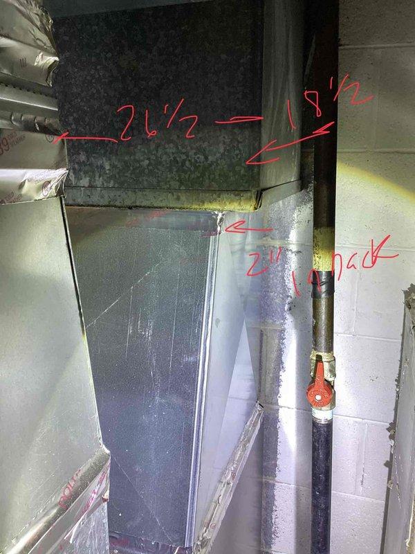 Conducted comfort consultation and provided estimate for complete air conditioning system replacement. Evaluated existing 21-year-old outdoor condenser unit located behind residence and assessed indoor air handler/plenum assembly in basement mechanical room. Documented existing equipment dimensions and configuration, including ductwork measurements and return air setup, to determine proper replacement unit sizing and installation requirements for new HVAC system.