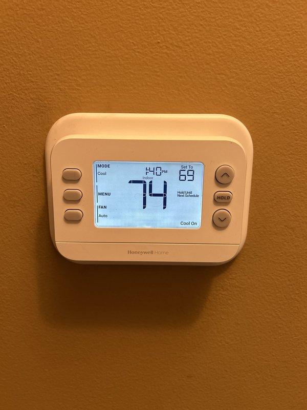 Completed full 2-ton air conditioning system and evaporator coil installation with all required mechanical, electrical, and AC permits. Installed new Honeywell Home digital thermostat with programmable temperature control and configured system for R-454B refrigerant compatibility. Reconnected existing humidifier to new system and verified all refrigerant service ports, copper line connections, and system controls are operational.
