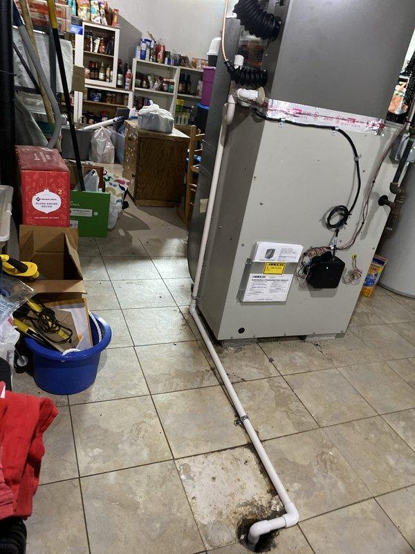 Completed installation of 2-ton Bryant air conditioning system with matching evaporator coil on left side of residence. Mounted condenser unit on composite pad against exterior brick wall, established proper electrical connections via junction boxes, and installed condensate drain line with PVC piping. Indoor air handler positioned in utility room with all refrigerant lines connected, ductwork attached, and system tested for proper operation and reconnection to existing infrastructure.