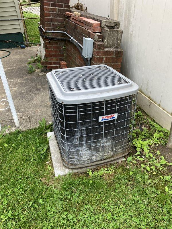 Conducted comprehensive inspection of 10-year-old furnace system located in basement following reports of operational concerns. Upon examination, identified cracked heat exchanger requiring immediate shutdown for safety reasons. Evaluated existing R22 refrigerant air conditioning system and outdoor condensing unit positioned on concrete pad in backyard area. Provided full system estimate for complete HVAC replacement due to failed heat exchanger and obsolete R22 refrigerant technology, documenting equipment condition through photographic records of outdoor condensing unit installation, electrical connections, and refrigerant line routing.