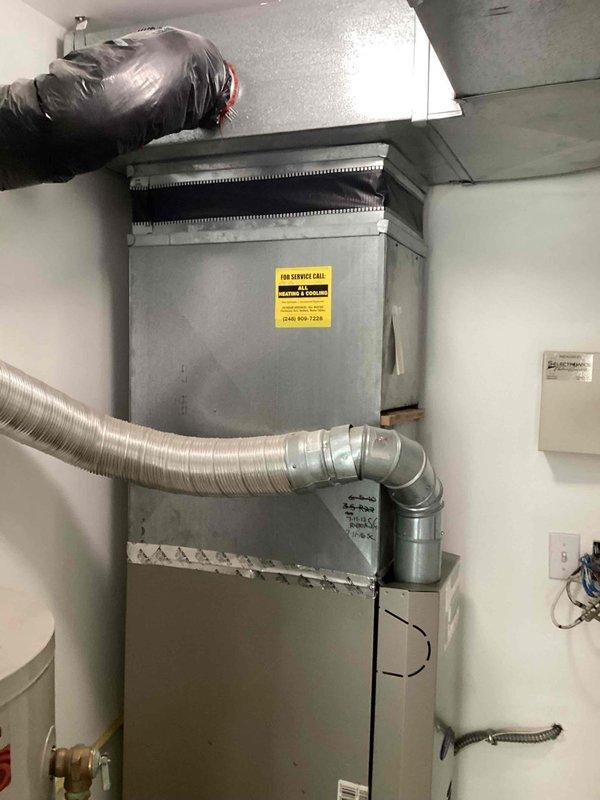 Performed city certification inspection on 10+ year old furnace and air conditioning system located in basement. Conducted comprehensive evaluation of HVAC equipment, including visual inspection of furnace cabinet, ductwork connections, venting system, and electrical components to verify compliance with municipal rental property requirements. Documented equipment condition with photographs showing furnace unit with proper labeling, flexible ductwork installation, and associated mechanical components in satisfactory operating condition for certification purposes.