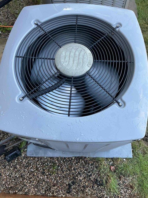 Responded to no cooling complaint on residential air conditioning system. Upon inspection, found condenser coil heavily obstructed with cottonwood seed debris and organic material, restricting airflow through the aluminum fins. Cleaned and cleared all foreign material from condenser coil using appropriate methods to restore proper airflow. Verified fan operation and unit functionality after cleaning. System restored to normal cooling operation.