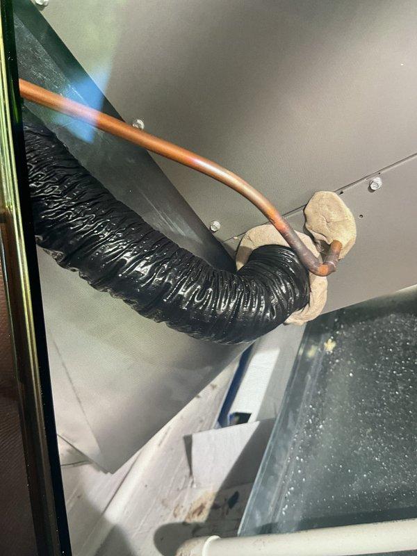 Completed comprehensive Gold AC inspection on 2-year-old residential cooling system with furnace coil located in crawlspace. Performed thorough evaluation of outdoor condenser unit, verifying proper operation of fan assembly, checking refrigerant lines, and inspecting electrical connections. Examined indoor coil assembly and ductwork connections in crawlspace, confirming proper installation of flexible duct runs and copper refrigerant lines with appropriate securing methods. All system components found operating within normal parameters with no deficiencies noted.