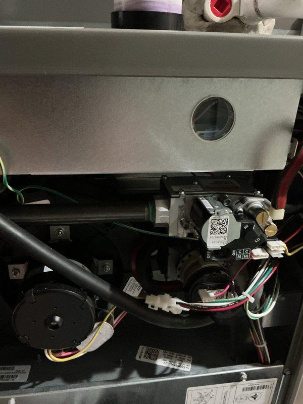 Performed routine maintenance inspection on 2-year-old residential HVAC system including furnace unit located in basement and outdoor air conditioning condenser. Conducted comprehensive tune-up service verifying proper operation of gas valve assembly, pressure switches, electrical connections, and control systems on heating unit. Inspected outdoor condensing unit including fan motor operation, refrigerant levels, and electrical connections. All components functioning within normal parameters with no deficiencies noted. Both systems operating efficiently with no issues reported or identified during inspection.