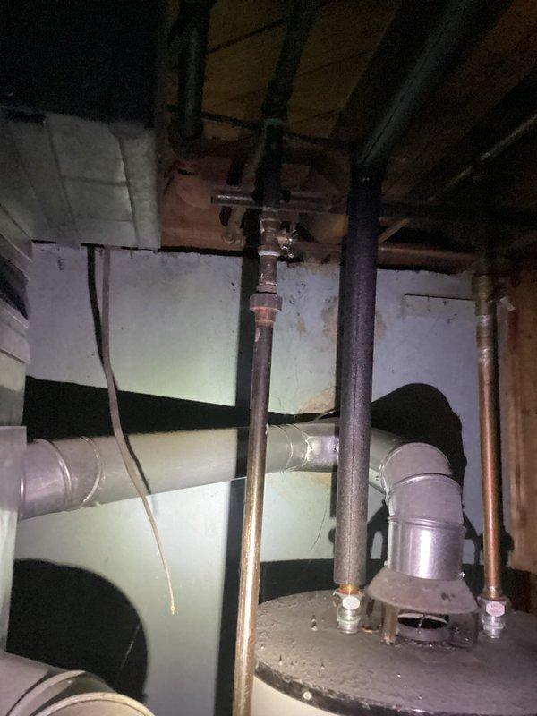Conducted comprehensive site assessment for HVAC system replacement estimate at residential property. Evaluated existing furnace installation located in basement mechanical room, documenting current equipment condition including visible cabinet discoloration and aging components. Inspected air conditioning unit positioned in backyard area. Photographed existing ductwork configuration, furnace cabinet assembly, and associated piping infrastructure including water heater connections and copper supply lines. Coordinated appointment access with authorized family member holding power of attorney to complete thorough equipment evaluation and prepare replacement quotation.