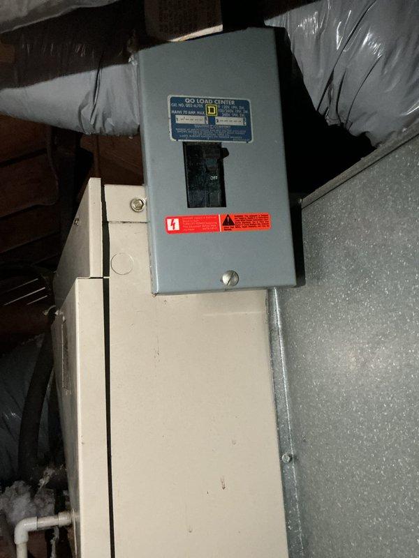 Provided estimate for complete air conditioning system replacement for a 37-year-old non-operational unit with outdoor condenser and air handler located in upstairs crawl space. Assessed existing installation including sagging flexible ductwork, electrical service panel, and attic-mounted blower unit. Property utilizes boiler system for heating, requiring coordination of cooling-only equipment replacement with existing infrastructure.