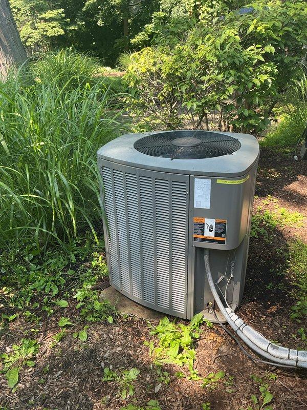 Completed comprehensive Gold AC Inspection on a five-year-old Lennox residential air conditioning system. Performed full system evaluation including refrigerant line inspection, condenser unit examination with horizontal louver assessment, and thermostat functionality verification showing proper cooling operation to setpoint of 74°F. Unit operating efficiently with no issues identified; system maintaining proper temperature differential between indoor setting and outdoor ambient temperature of 81°F.