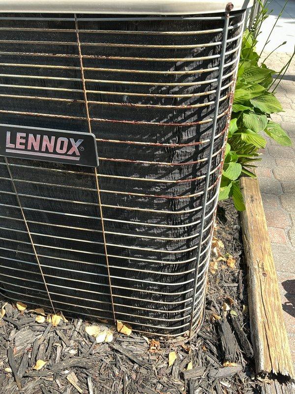 Completed annual cooling maintenance and tune-up on a 27-year-old Lennox outdoor condenser unit. Performed comprehensive system inspection, verified proper operation of all components, and confirmed unit is functioning correctly. Condenser showed normal wear for age with some debris accumulation in fins and surrounding landscape area, system operating within normal parameters at time of service.