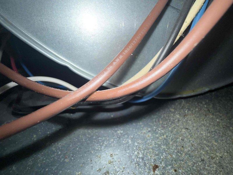 Responded to no heat call on 10-year-old furnace located in basement. Upon arrival, confirmed system was completely off with no heat to entire home. Performed diagnostic inspection of furnace control board and electrical connections. Examined blower control circuit board showing blower off delay module with multiple wire terminations and connections intact. Verified all wire harness connections at terminal blocks were secure with proper color-coded wiring to board. Inspected electrical cable bundle routing through equipment cabinet with appropriate insulation protection at penetration points. Diagnosed control board failure preventing system operation. Replaced faulty control board and restored all electrical connections to proper terminals. Cycled system through complete heating operation, verified ignition sequence, confirmed blower motor engaged on proper delay timing, and validated adequate heat output to distribution system. System restored to full operational status with no heat 