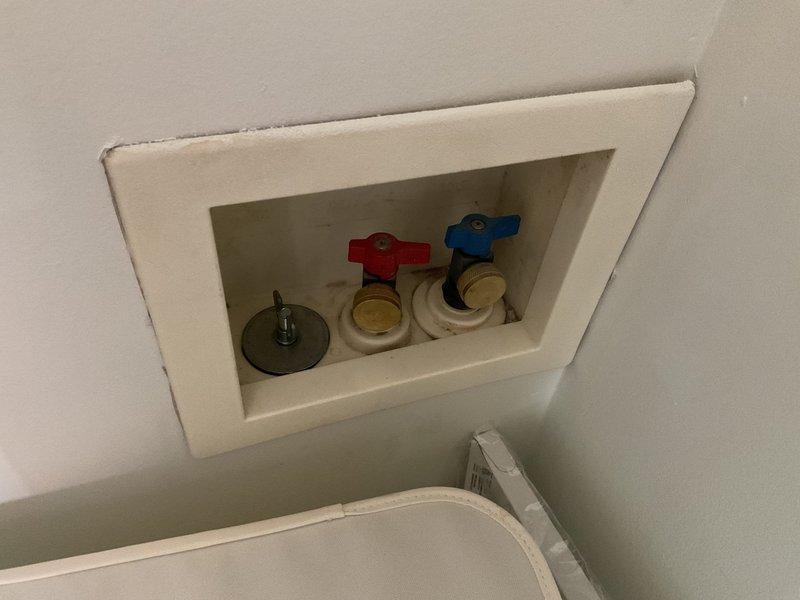 Responded to service call for malfunctioning garbage disposal and odor issue from capped gas line in former laundry closet. Inspected under-sink garbage disposal unit, including electrical connections, mounting assembly, and PVC drain configuration. Verified proper operation of disposal motor, reset mechanism, and drainage system. Addressed malfunction through troubleshooting of electrical supply and mechanical components. Examined recessed wall box in closet area containing capped water supply lines with quarter-turn ball valves for hot and cold connections. Investigated source of gas odor related to previously capped gas line where washer and dryer were formerly located. Ensured all plumbing connections were secure and functioning properly. Restored garbage disposal to full working order and addressed ventilation concerns in closet area.